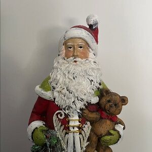 Tii Collections Santa Claus resin figurine, a handcrafted holiday decoration.